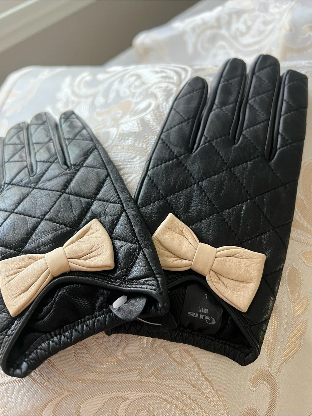 Black Quilted Leather Gloves with Beige Bow Accent